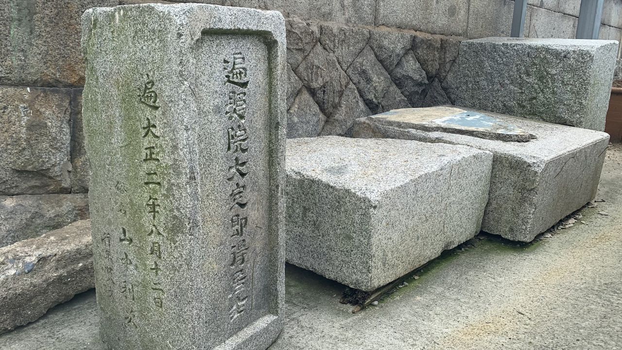 A tombstone displayed outside a house in Ami-dong, Busan, South Korea, on August 20.